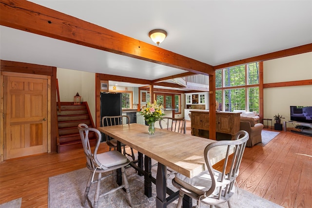 577 Fiddlers Bridge Rd, Staatsburg, NY 12580 - dining area featuring light wood-style flooring, beamed ceiling, and stairs