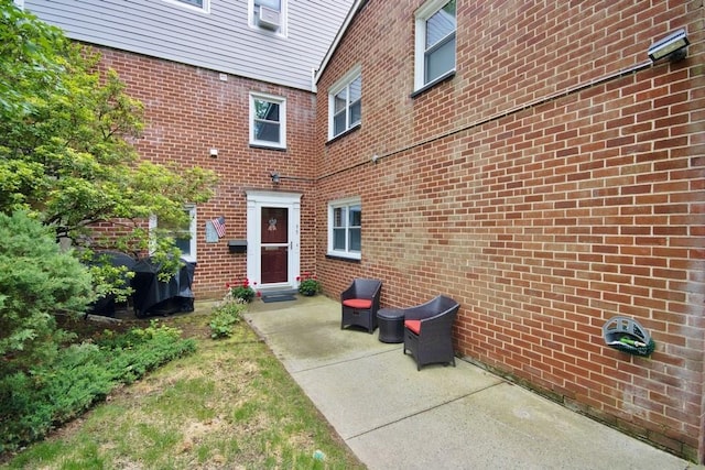 95 Charter Cir Unit 95, Ossining, NY 10562 - entrance to property featuring a patio area and brick siding