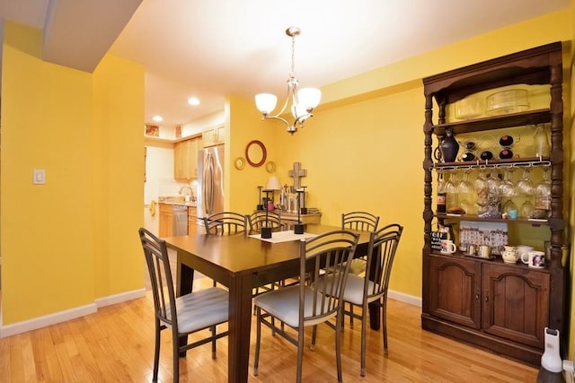 95 Charter Cir Unit 95, Ossining, NY 10562 - dining area with baseboards, light wood-style floors, a chandelier, and recessed lighting