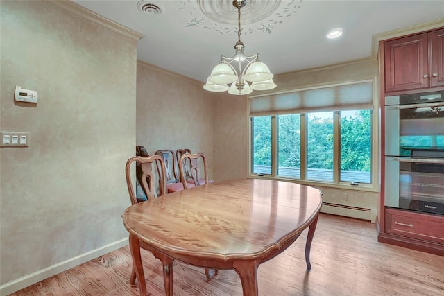 6 Emily Ln, Monroe, NY 10950 - dining room featuring a chandelier, a baseboard heating unit, light wood finished floors, crown molding, and baseboards
