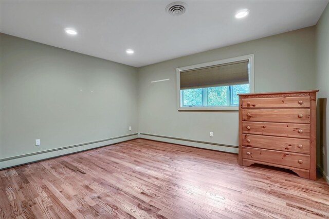 6 Emily Ln, Monroe, NY 10950 - unfurnished bedroom featuring light wood-type flooring, a baseboard heating unit, baseboards, and recessed lighting