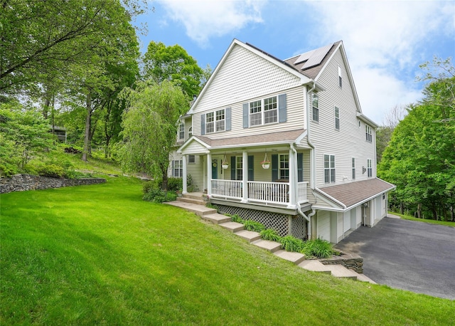 27 Millstream Ct, Pawling, NY 12564 - view of front of house featuring covered porch, driveway, a garage, and a front lawn