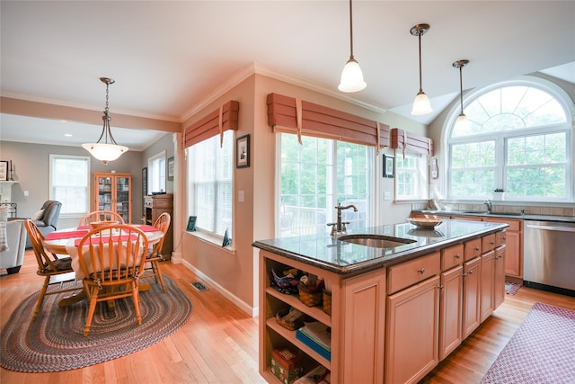 27 Millstream Ct, Pawling, NY 12564 - kitchen featuring stainless steel dishwasher, plenty of natural light, light wood finished floors, and ornamental molding
