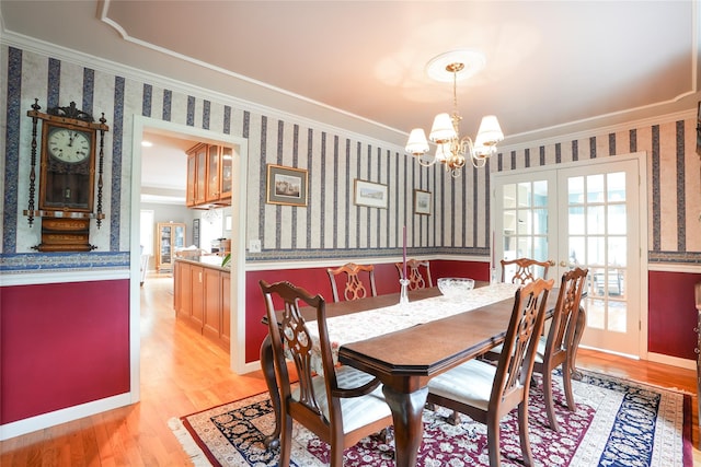 27 Millstream Ct, Pawling, NY 12564 - dining room with ornamental molding, wallpapered walls, a chandelier, and light wood finished floors