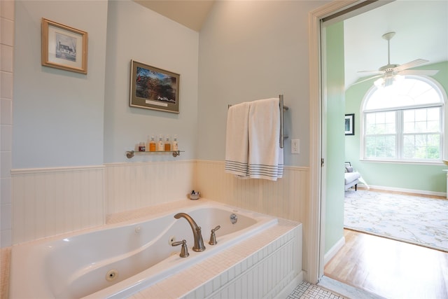 27 Millstream Ct, Pawling, NY 12564 - bathroom with a jetted tub, ceiling fan, and wainscoting