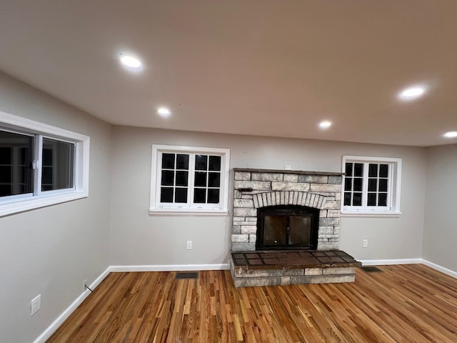 2411 Goshen Tpke, Middletown, NY 10941 - unfurnished living room with wood finished floors, baseboards, recessed lighting, and a fireplace