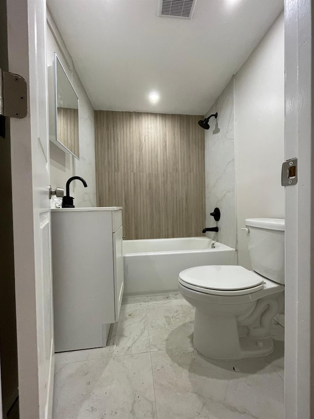 2411 Goshen Tpke, Middletown, NY 10941 - full bathroom featuring toilet, marble look tile flooring, vanity, and  shower combination