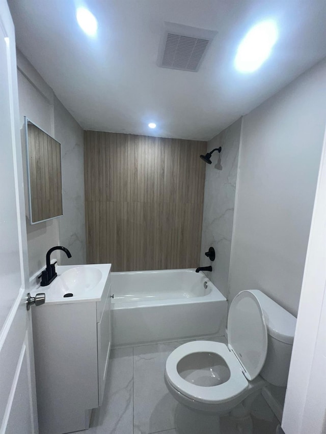 2411 Goshen Tpke, Middletown, NY 10941 - full bathroom featuring toilet, vanity, marble look tiles, tub / shower combination, and recessed lighting