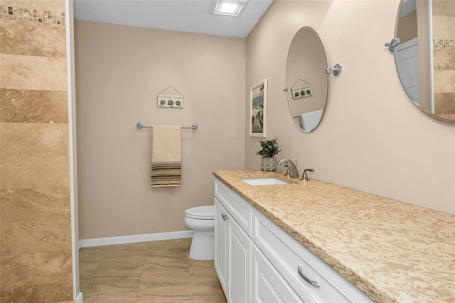 99 S Park # 308, Rockville Centre, NY 11570 - bathroom featuring toilet, vanity, baseboards, and tiled shower