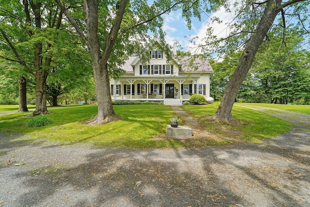 90 Main St, Chester, NY 10918 - view of front of home with covered porch, a chimney, and a front lawn