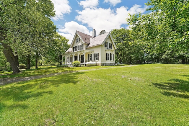 90 Main St, Chester, NY 10918 - view of front of home with covered porch, a chimney, a front yard, and roof with shingles
