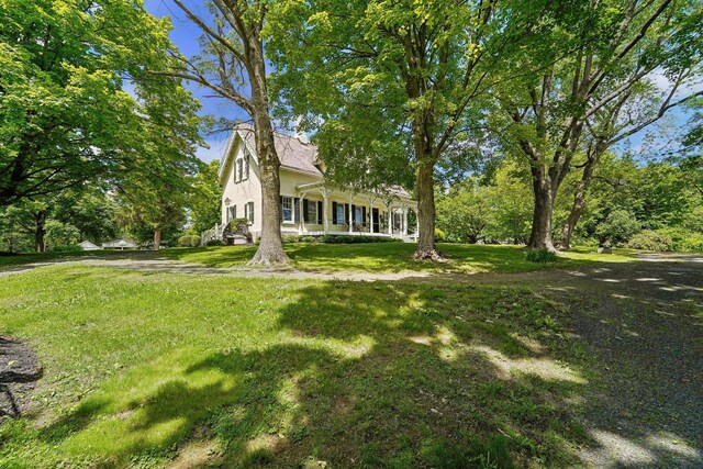 90 Main St, Chester, NY 10918 - view of front of house with a front lawn and stucco siding