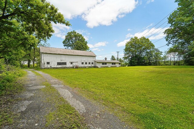 90 Main St, Chester, NY 10918 - view of green lawn with an outdoor structure