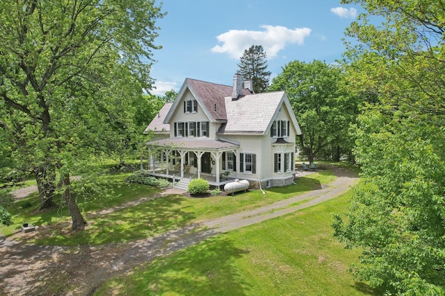 90 Main St, Chester, NY 10918 - rear view of property with a porch, driveway, a chimney, and a yard