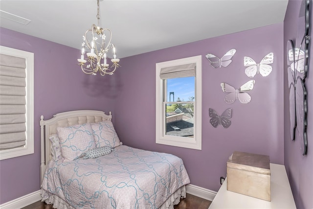 148-03 9th Ave, Whitestone, NY 11357 - bedroom with a chandelier, baseboards, and wood finished floors