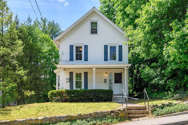 36 Elm St, Pawling, NY 12564 - view of front facade featuring a porch and a front yard