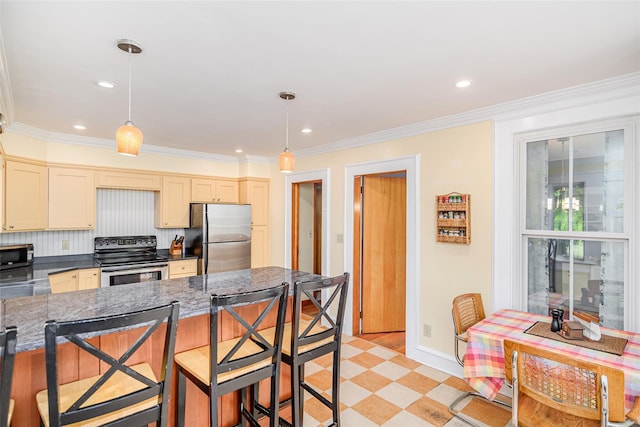 36 Elm St, Pawling, NY 12564 - kitchen featuring appliances with stainless steel finishes, a breakfast bar, recessed lighting, crown molding, and pendant lighting