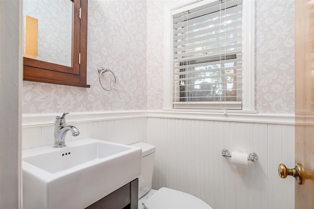 36 Elm St, Pawling, NY 12564 - bathroom with wallpapered walls, a wainscoted wall, toilet, and vanity