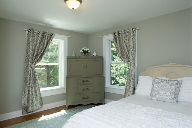 36 Elm St, Pawling, NY 12564 - bedroom featuring multiple windows, wood finished floors, and baseboards