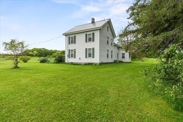 4248 Western Tpke, Call Listing Agent, NY 12009 - view of home's exterior featuring a chimney, a lawn, and metal roof