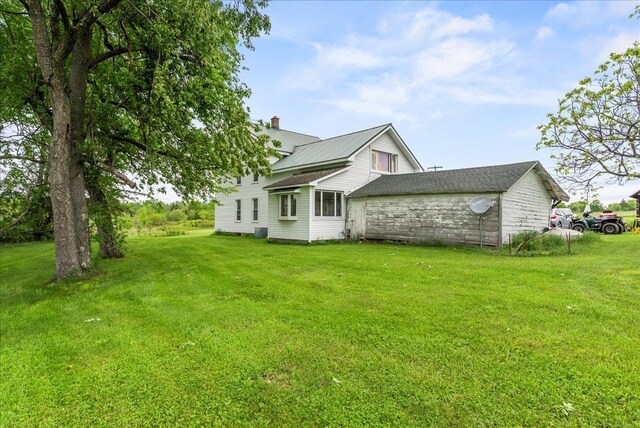 4248 Western Tpke, Call Listing Agent, NY 12009 - back of house featuring a chimney and a lawn