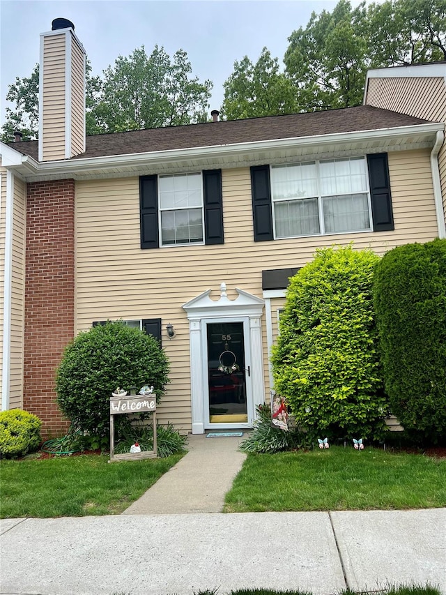 55 Winchester Ave, Peekskill, NY 10566 - view of front of house with a chimney