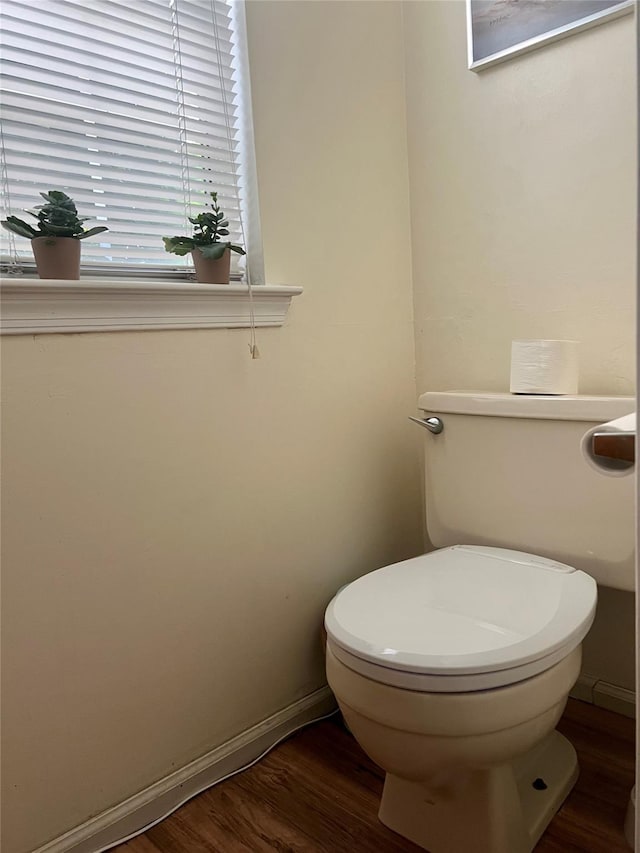 55 Winchester Ave, Peekskill, NY 10566 - bathroom with toilet, wood finished floors, and baseboards