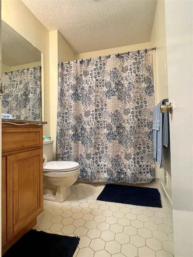 55 Winchester Ave, Peekskill, NY 10566 - bathroom with toilet, a textured ceiling, tile patterned floors, and vanity