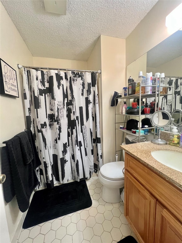 55 Winchester Ave, Peekskill, NY 10566 - bathroom featuring vanity, a textured ceiling, toilet, tile patterned flooring, and a shower with curtain