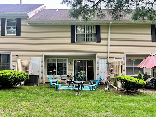 55 Winchester Ave, Peekskill, NY 10566 - back of property featuring a yard and a shingled roof