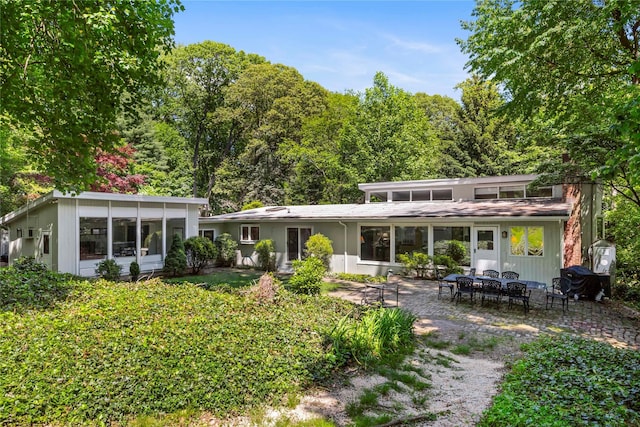 6 Harbor Hill Dr, Lloyd Harbor, NY 11743 - back of property with a patio area and a sunroom