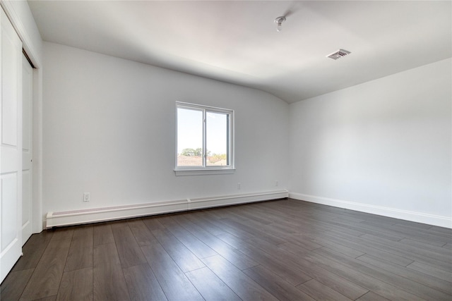 22 May Pl, Staten Island, NY 10312 - unfurnished bedroom featuring a baseboard radiator, dark wood-style flooring, baseboards, vaulted ceiling, and a closet