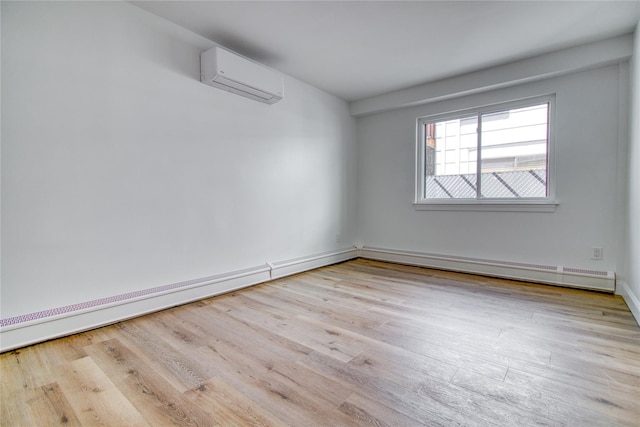22 May Pl, Staten Island, NY 10312 - unfurnished room with a wall mounted air conditioner, wood finished floors, and baseboards