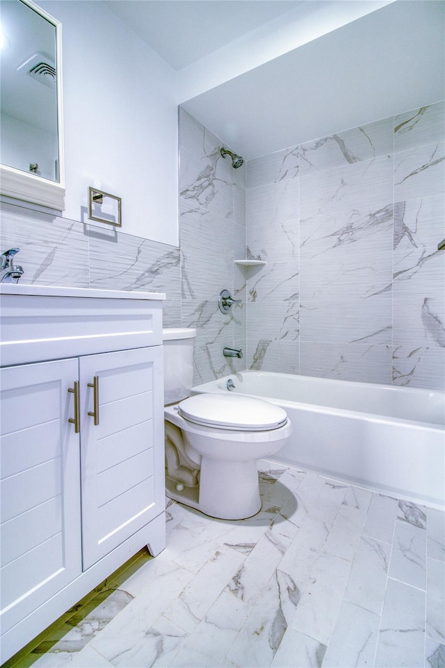 22 May Pl, Staten Island, NY 10312 - full bath featuring toilet, vanity, shower / bath combination, tile walls, and marble look tile flooring