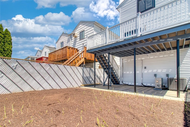 22 May Pl, Staten Island, NY 10312 - view of property exterior with central AC, a deck, a fenced backyard, stairway, and a patio area