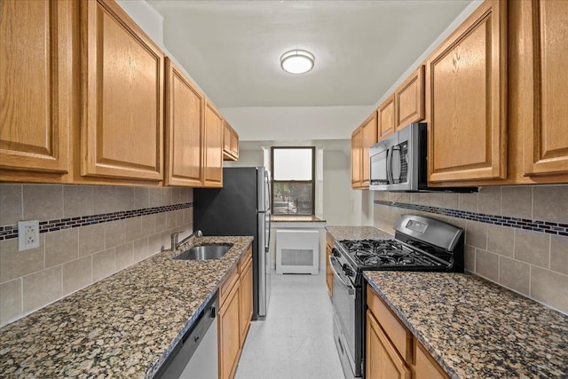 20 William St Unit B, Mount Vernon, NY 10552 - kitchen featuring stainless steel appliances, tasteful backsplash, a sink, and dark stone counters