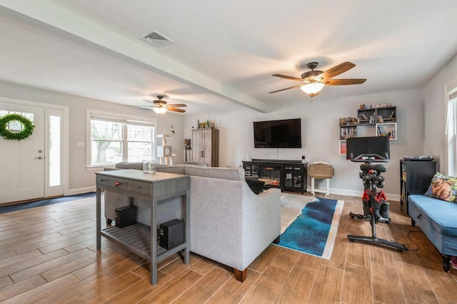 130 Shenandoah Blvd N, Nesconset, NY 11767 - living room featuring ceiling fan, wood finished floors, plenty of natural light, and beam ceiling