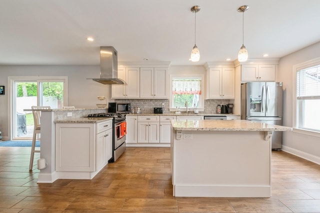 130 Shenandoah Blvd N, Nesconset, NY 11767 - kitchen with stainless steel appliances, island exhaust hood, healthy amount of natural light, and recessed lighting
