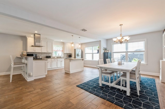130 Shenandoah Blvd N, Nesconset, NY 11767 - dining space featuring a chandelier, baseboards, light wood finished floors, and recessed lighting