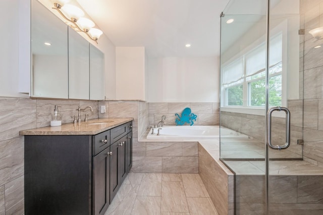 130 Shenandoah Blvd N, Nesconset, NY 11767 - full bathroom with vanity, a garden tub, a shower with door, recessed lighting, and marble finish floors
