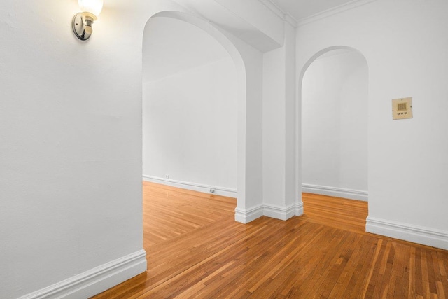 3656 Johnson Ave Unit 4G, Bronx, NY 10463 - spare room with arched walkways, wood-type flooring, crown molding, and baseboards