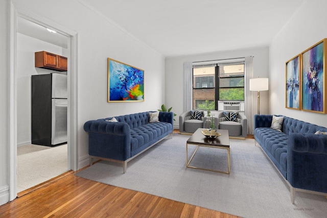 3656 Johnson Ave Unit 4G, Bronx, NY 10463 - living room featuring light wood-type flooring, crown molding, baseboards, and cooling unit