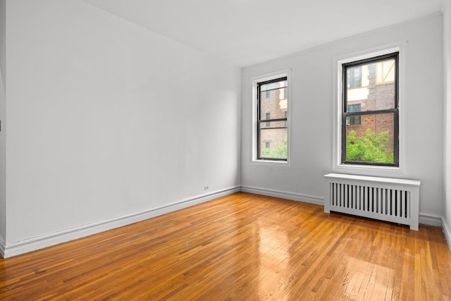 3656 Johnson Ave Unit 4G, Bronx, NY 10463 - unfurnished room with radiator heating unit, hardwood / wood-style flooring, and baseboards