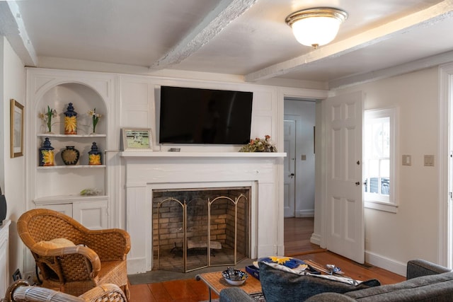 8 Chicken Valley Rd, Old Brookville, NY 11545 - living room featuring beamed ceiling, a fireplace, wood finished floors, and built in features