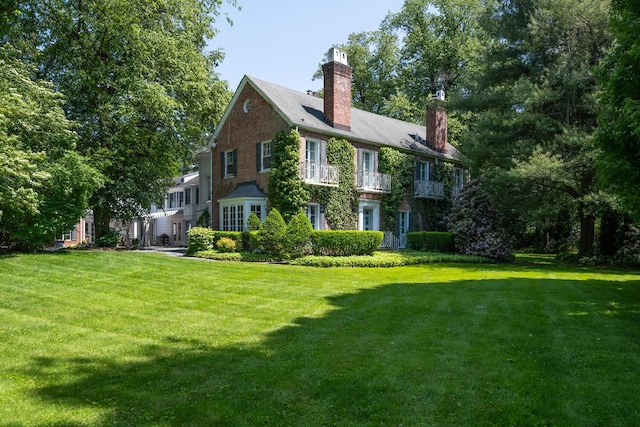 8 Chicken Valley Rd, Old Brookville, NY 11545 - rear view of property with a chimney and a lawn