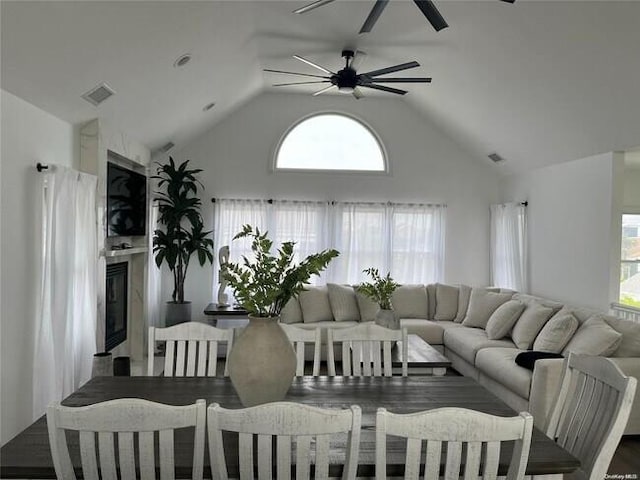 24 Bungalow Walk, Ocean Beach, NY 11770 - living room featuring a ceiling fan, high vaulted ceiling, and a high end fireplace