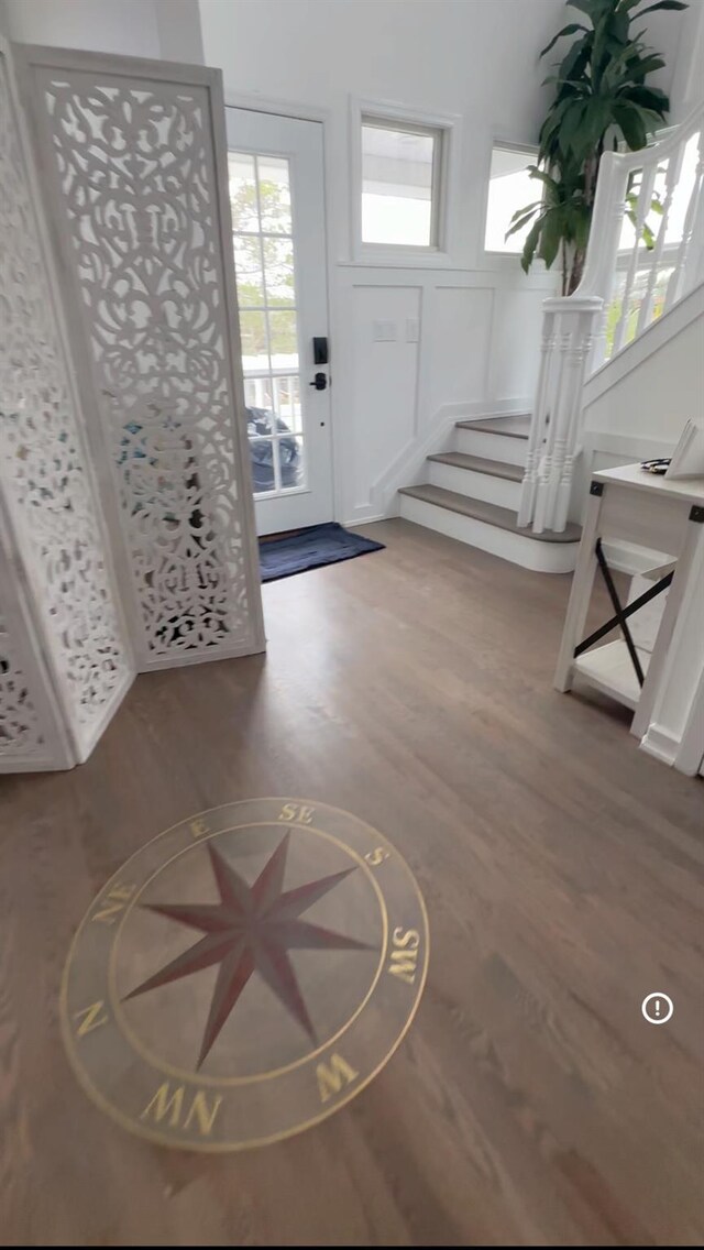 24 Bungalow Walk, Ocean Beach, NY 11770 - entryway featuring stairway, wood finished floors, a decorative wall, and healthy amount of natural light