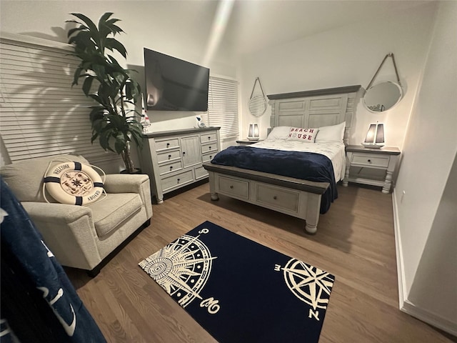 24 Bungalow Walk, Ocean Beach, NY 11770 - bedroom featuring wood finished floors, baseboards, and a towering ceiling