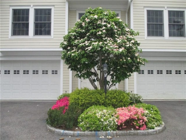 29 Carpenter Ave Unit B3, Mount Kisco, NY 10549 - property entrance with asphalt driveway and a garage