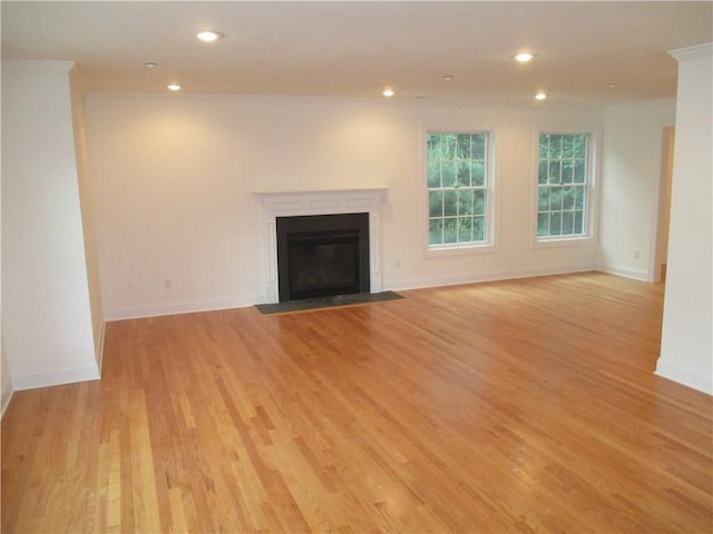 29 Carpenter Ave Unit B3, Mount Kisco, NY 10549 - unfurnished living room featuring recessed lighting, light wood-style flooring, a fireplace with flush hearth, baseboards, and ornamental molding